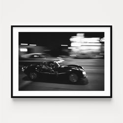 Photographie Noir & Blanc Steve McQueen driving his Jaguar on Sunset Boulevard